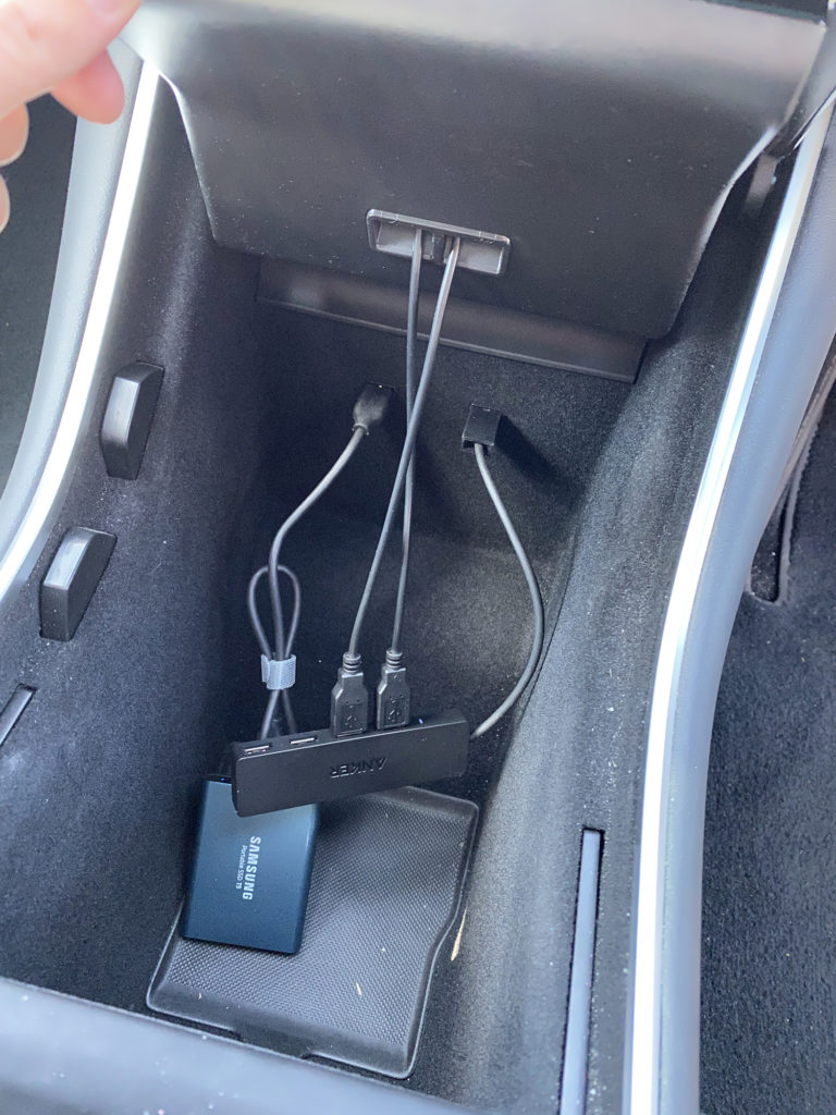 Tesla Model 3 with wireless charger, hub and storage for sentry / dash cam